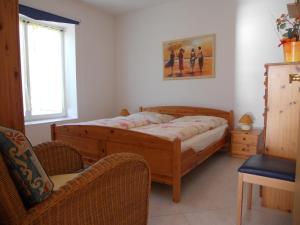Llit o llits en una habitació de Haus Seeblick Insel Rügen