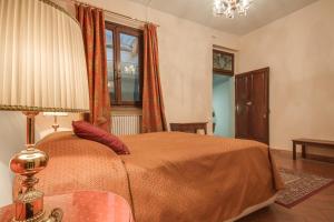 Ліжко або ліжка в номері Lungarno Ponte Vecchio