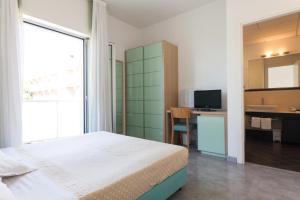 TV a/nebo společenská místnost v ubytování Hotel Sahara