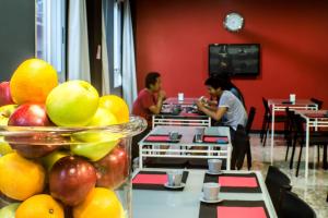 a table filled with lots of fruit and drinks at Quart Youth Hostel & Apartments in Valencia