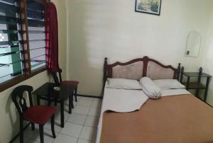 Katil atau katil-katil dalam bilik di Liemas hotel