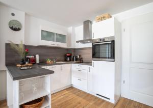 Η κουζίνα ή μικρή κουζίνα στο Haus Windböe, Wohnung 8