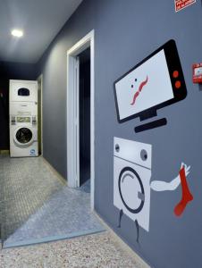 a room with a computer monitor on a wall at Quart Youth Hostel & Apartments in Valencia
