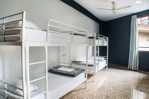 two bunk beds in a room with a ceiling fan at Quart Youth Hostel & Apartments in Valencia