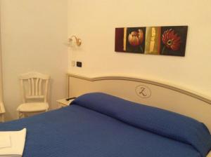 Postel nebo postele na pokoji v ubytování Hotel La Zorza