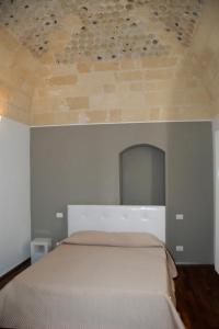 Postel nebo postele na pokoji v ubytování B&B Antico Castello