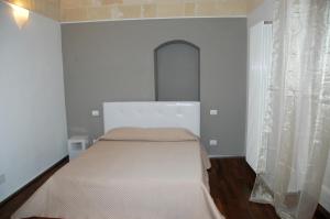 Postel nebo postele na pokoji v ubytování B&B Antico Castello