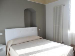 Postel nebo postele na pokoji v ubytování B&B Antico Castello