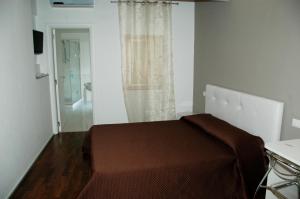 Postel nebo postele na pokoji v ubytování B&B Antico Castello
