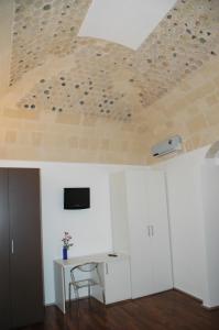 TV a/nebo společenská místnost v ubytování B&B Antico Castello