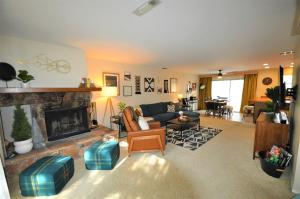 a living room with a couch and a fireplace at Gnome and Creek Yosemite Condo in Groveland