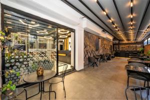 a restaurant with tables and chairs in a room at Confores Hotel in Istanbul