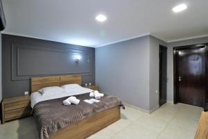 Ein Bett oder Betten in einem Zimmer der Unterkunft Hotel Rose