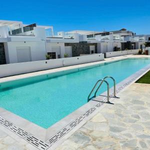 The swimming pool at or close to Longbeachvillas 2 Thesia beachfront villa