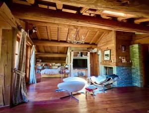 a living room with a couch and a fireplace at Chalet Altus in Sainte-Foy-Tarentaise