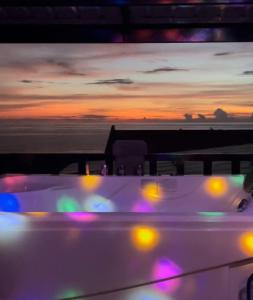 a view of the back of a boat at sunset at The Palms Resort & Bar in San Narciso