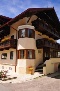 a building with balconies and stairs in front of it at Chalet Sonneck in Seefeld in Tirol