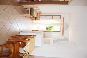 a small bathroom with a sink and a window at Villa Rebecca in Agios Gordios