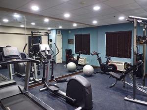 a gym with several exercise equipment in a room at Sleep Inn & Suites in California