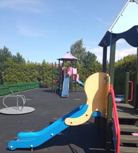 a playground with a slide and a play structure at Nadmorski apartament Sunset w Stegnie - Mierzeja Wiślana in Stegna