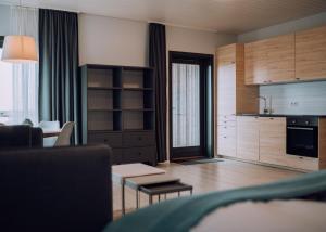 a room with a kitchen and a living room at Heima Holiday Homes in Selfoss