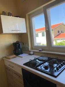 Kuchyň nebo kuchyňský kout v ubytování Apartman Jole