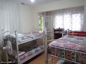 Postel nebo postele na pokoji v ubytování HZD Apartments Hostel