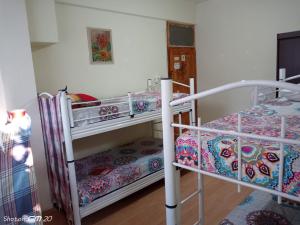 Postel nebo postele na pokoji v ubytování HZD Apartments Hostel