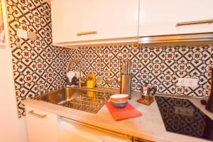 a kitchen with a sink and a counter top at Book Jet - Casa Adam in Morro del Jable