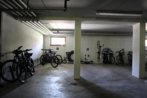 a parking lot with bikes parked in a garage at Appartement-Hotel Happy Kienberg in Pfronten