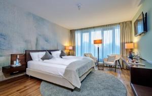 Ein Bett oder Betten in einem Zimmer der Unterkunft Asam Hotel