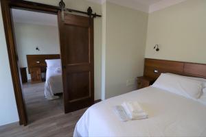 A bed or beds in a room at Casale Sienti'n Può