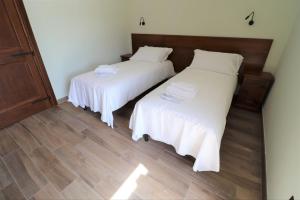 A bed or beds in a room at Casale Sienti'n Può