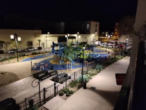 a view of a swimming pool at night at Romy in Boulogne-sur-Mer