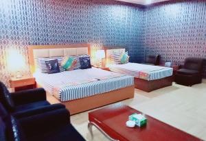 Ένα ή περισσότερα κρεβάτια σε δωμάτιο στο Hotel Versa Appartments lodges Gulberg3