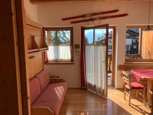 a living room with a couch and a table at Residence Valpiccola in Val di Zoldo