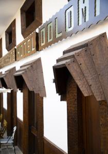 a building with a sign that reads hotel holoit at Hotel Dolomiti in Castelmezzano