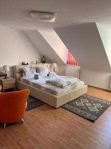 a bedroom with a large bed in a attic at Panorama Studio Sighisoara in Sighişoara