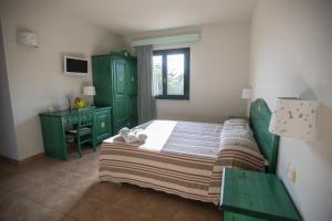 A bed or beds in a room at Le Vanille