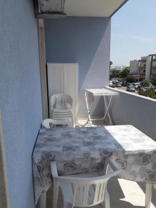 a balcony with a table and chairs on a balcony at Casa in SALENTO a Otranto in Otranto