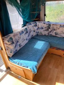 a bunk bed in a room with a window at Синеморец Каравана Paradise in Sinemorets +27 photos
