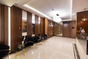 a conference room with chairs and a hallway at Merida Hotel Baku in Baku