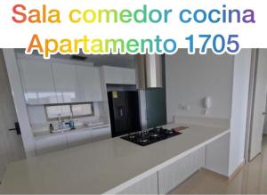 a kitchen with a white counter top with a stove at Club de Playa Samaria - T1 APTO 1705, Santamarta in Santa Marta