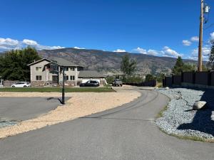 a winding road in front of a house at Kaleden Guest Suite in Okanagan Falls