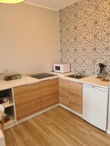 a kitchen with a sink and a microwave at Cozy Studio Sea View in Chayofa in Chayofa