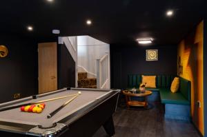 a billiard room with a pool table and a couch at Ultimate glam, vintage central pad. Cool 70s bar. in Bournemouth +62 photos