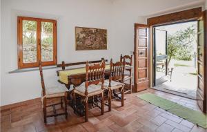 a dining room with a wooden table and chairs at Casa La Montesca in Città di Castello