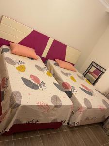 Ліжко або ліжка в номері Villa Telal Ain Sokhna