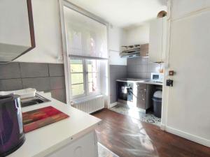 a kitchen with a sink and a counter top at Number 22 - Le Dorat - Apartment One with garden & free parking in Le Dorat +29 photos