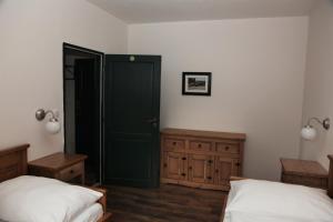 Postel nebo postele na pokoji v ubytování Aparthotel Mádr